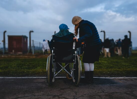 Care Worker With Woman In Wheelchair
