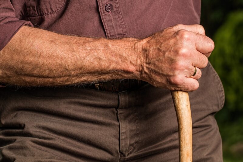 Elderly Man Holding Cane
