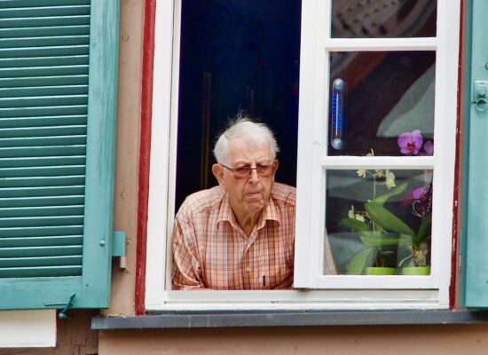 Elderly Man Looking Out Window Safety