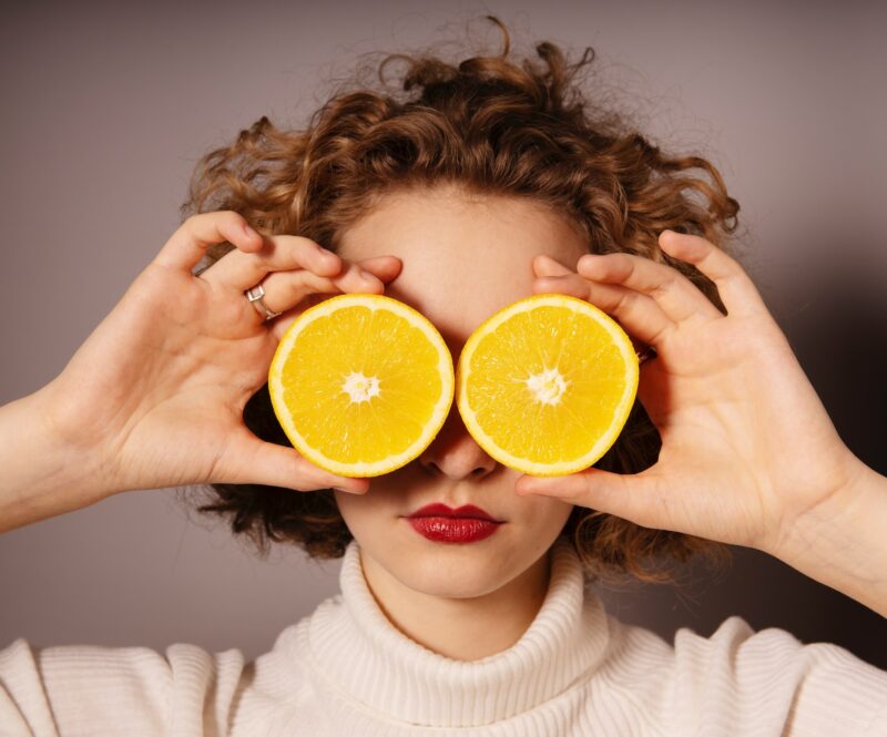 Woman Holding Orange